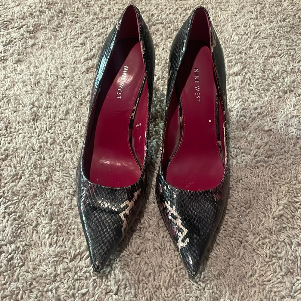 Nine West pink ,black ,and purple snake skin pumps.  Great for a pop of color